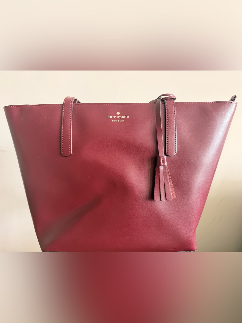 kate spade burgundy leather tote with tassel